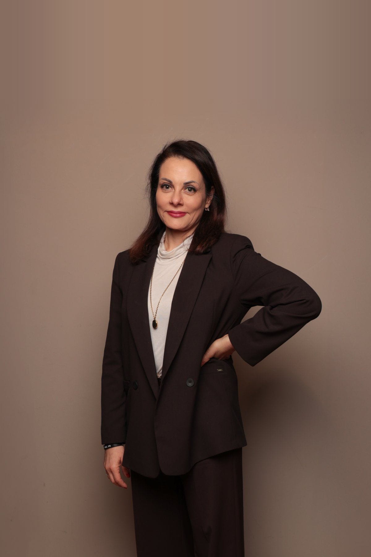 Katia Triggiani, executive and business coach, standing in a studio